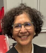 Photo of Doctor Nirupama Agrawal. She wears glasses and has short brown hair.